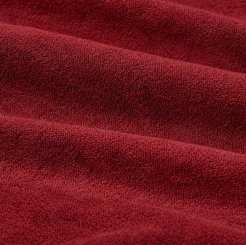Close-up of maroon terry fabric texture