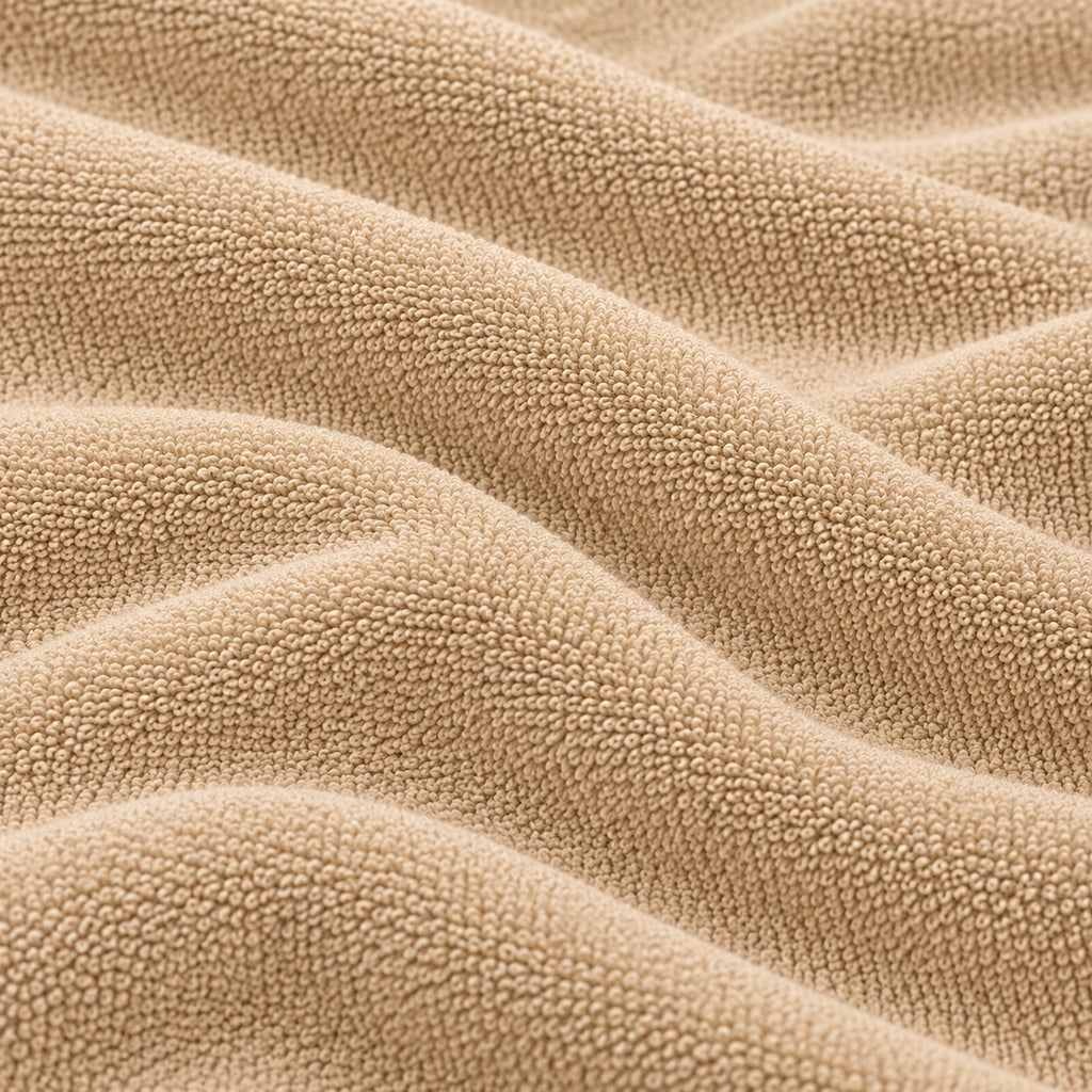 Close-up of the beige Terry Mattress Protector terry cloth texture