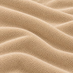 Close-up of the beige Terry Mattress Protector terry cloth texture