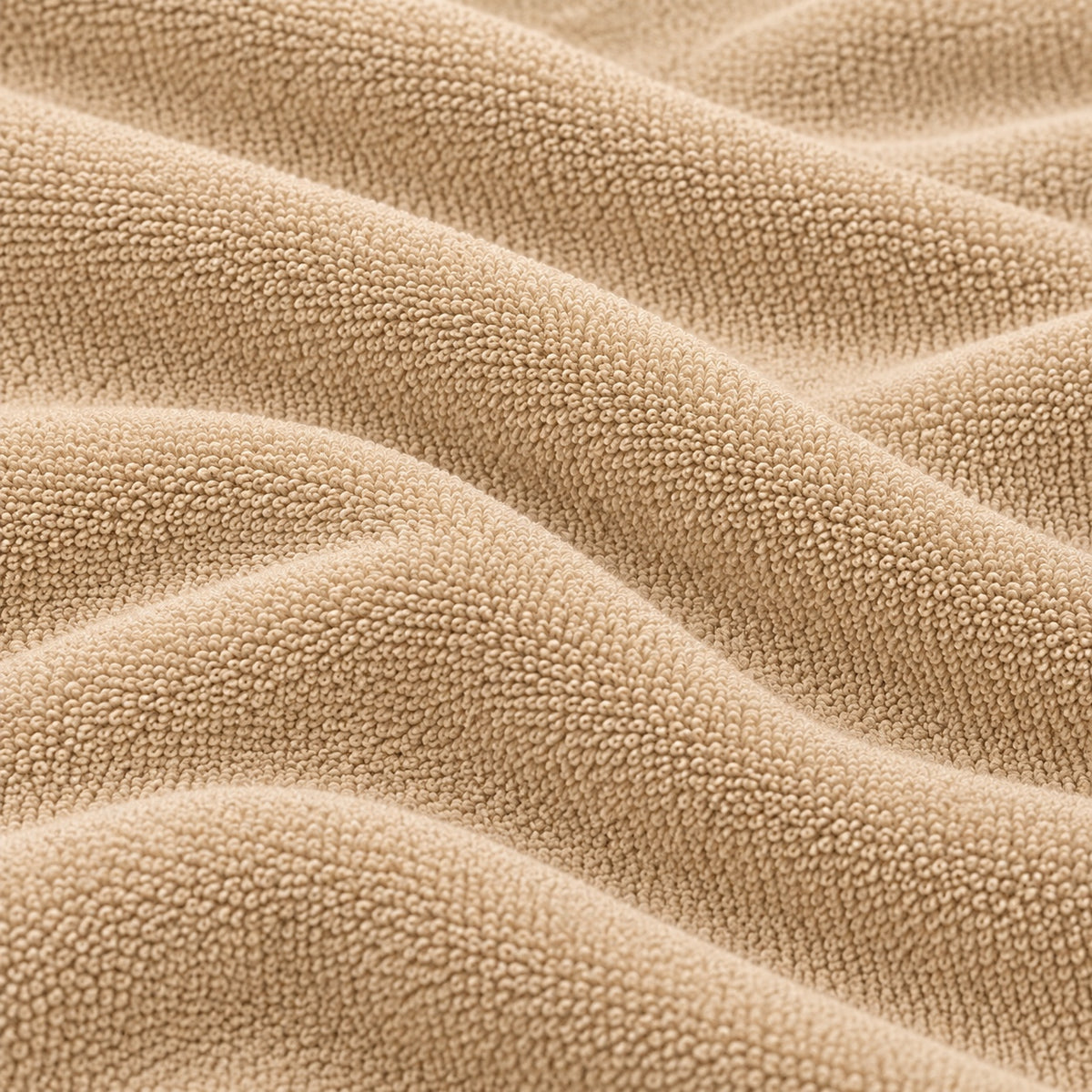 Close-up of the beige Terry Mattress Protector terry cloth texture