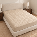 Beige quilted mattress protector – full bed