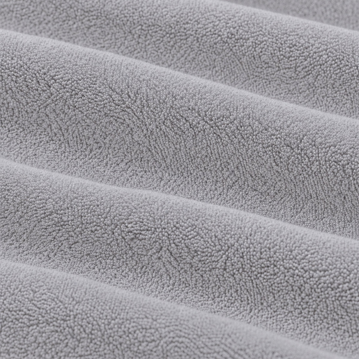 Close-up of the grey Terry Mattress Protector fabric texture