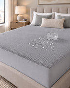 Water beading on the grey Terry Mattress Protector